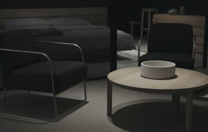 Elegant dimly lit room with dark furniture